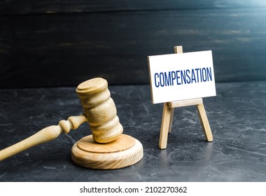 Compensation and judge's gavel. Award of moral financial compensation for caused damage. Lawyer services. Workers rights protection. Raising wages. Determination of payments by a court order. - Shutterstock ID 2102270362
