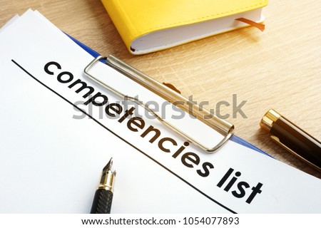 Competencies list with clipboard on a table.
