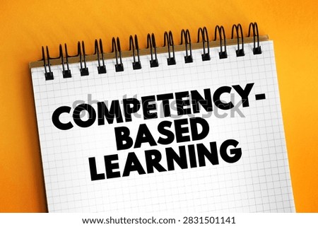 Competency-Based Learning text on spiral notebook with grid paper, modern educational methodology focusing on mastery, skill demonstration and personalized progression in corporate training programs