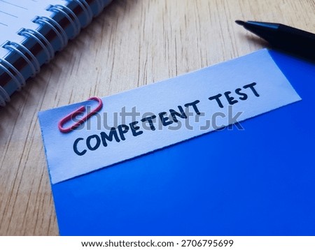 Competent test writting on table background. 