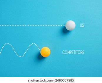 Competition and business performance. Speed, efficiency and precision to achieve goals. Competing table tennis balls on blue background with the words us and competitors. - Powered by Shutterstock