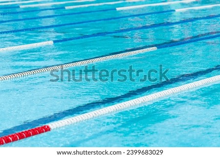 competition pool with blue water and marked swimming lanes.