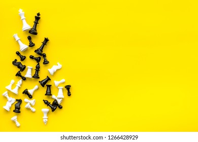 Competition or victory or strategy concept. Chess figures on yellow background top view copy space - Shutterstock ID 1266428929