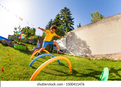 Competitive active game - boy jump over obstacles - Powered by Shutterstock