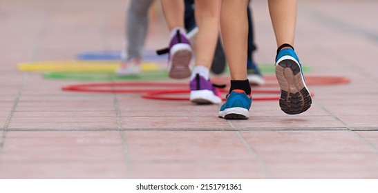 Competitive active game, children jump over obstacles - Powered by Shutterstock