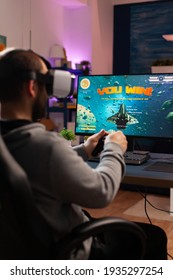 Competitive Gamer Using Professional Joystick Playing Online Shooter Game Late At Night With Vr Headset. Virtual Online Streaming Cyber Performing During Live Game Tournament