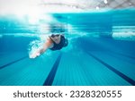 Competitive swimmer racing in pool