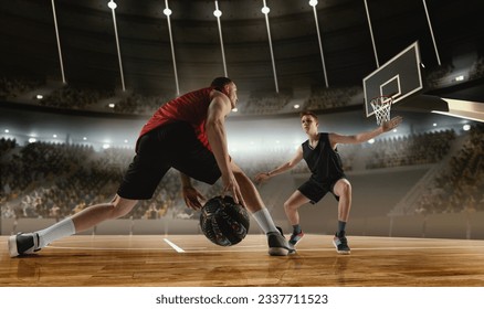 Competitive young men, basketball players in motion during match, game playing at 3D arena with flashlights. Scoring winning goal. Concept of professional sport, competition, action, hobby, game. - Powered by Shutterstock