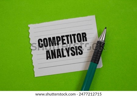 Competitor analysis message written on ripped paper piece with greenbackground. Conceptual competitor analysis symbol. Copy space.