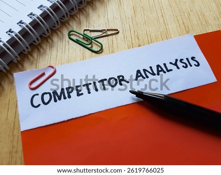 Competitor analysis writting on table background.