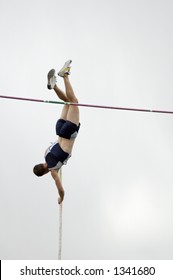 A Competitor In The Men's Pole Vault Event During A College Track Meet.