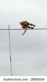 A Competitor In The Men's Pole Vault Event During A College Track Meet.