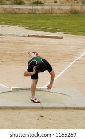 A Competitor In The Men's Shot Put Event During A College Track Meet.