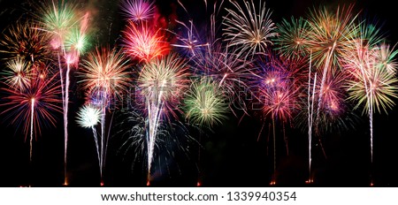 A compilation of fireworks on a long horizontal image.