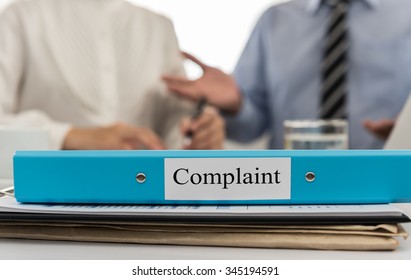 Complaint document folder and business team meeting to solve problems and improve the image of the company. - Shutterstock ID 345194591