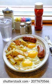 Complete American Diner Breakfast Three Sunny Side Up Fried Eggs Sausage And Home Fries