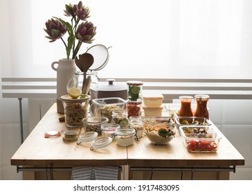 Complete batch cooking scene over a wooden kitchen table. - Shutterstock ID 1917483095