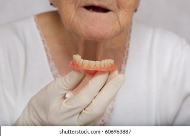 Complete denture on a stomatological table. Closeup