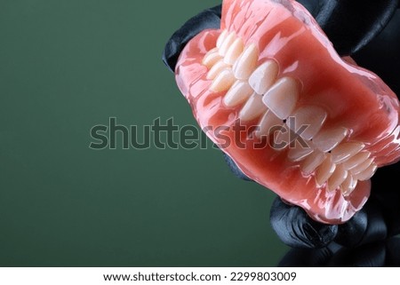 Complete dentures close up. Copy space and selective focus