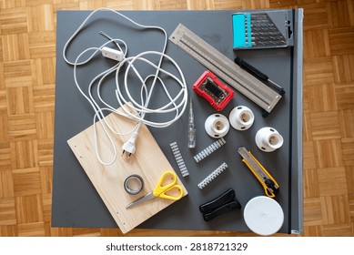 Complete DIY ceiling light installation kit arranged on a worktable