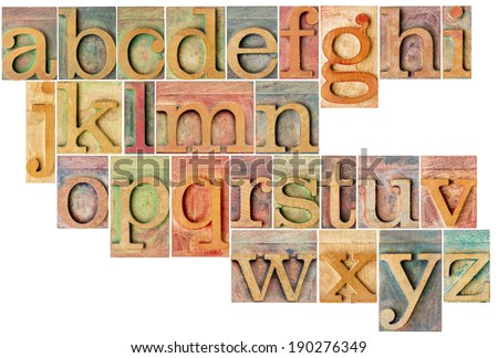 complete English lowercase alphabet - a collage of 26 isolated antique wood letterpress printing blocks, stained by color inks