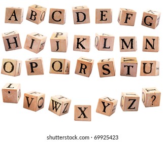 A complete set of rustic alphabet blocks A - Z plus an apostrophe and question mark.  They are oriented differently to appear as if they are falling.  Isolated on white.