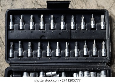 A complete set of workshop tools arranged inside a toolbox. The image represents mechanical work, repair equipment, and professional maintenance tools.