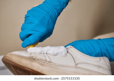 The Complete Shoe Cleaning Process Utilizing Foam and Protective Gloves for Effective Results