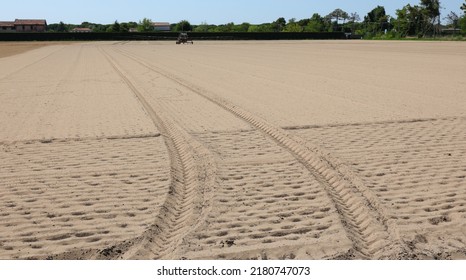 Completely Dry Arid Field Without Seedlings With Tractor Tire Marks Due To The Terrible Drought That Hit The Plains And Crops In Summer