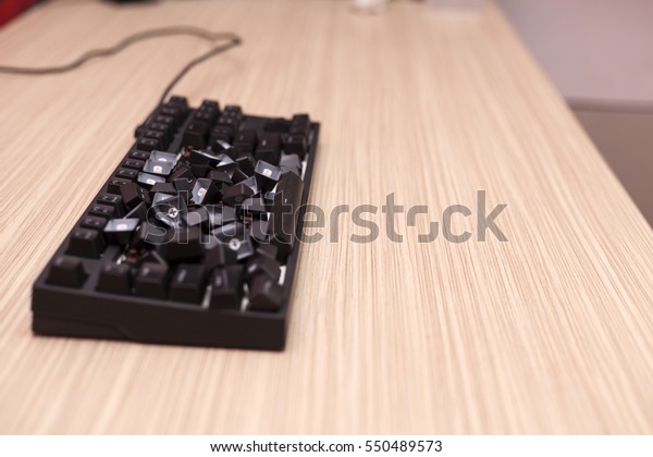 Completely smashed\
mechanical computer\
keyboard