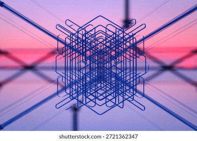 A complex, abstract wireframe structure set against a vibrant sunset background, creating a sense of depth and intrigue.
