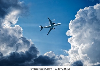 Complex Flight Conditions - Plane Flies Through Storm Clouds, Rainy Weather, Storm Front.  Concept Of Air Safety. Empty Place For Copy Space.