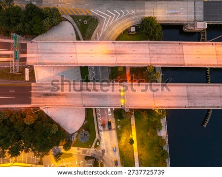 Complex freeway interchange in Tampa with elevated roads, bridges and city lights defining modern American metropolis