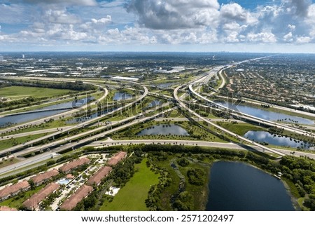 Complex highway overpass elevated direction lanes with busy traffic in Miami, Florida. American high speed road crossroads
