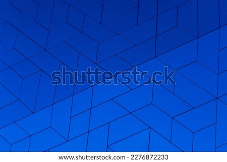 Complex interplay thin lines shapes. Metalic blue abstract background texture. seamless geometric ceramic tiles patterns. detail of the external layer of a wall. intense, bold and vibrant blue color.