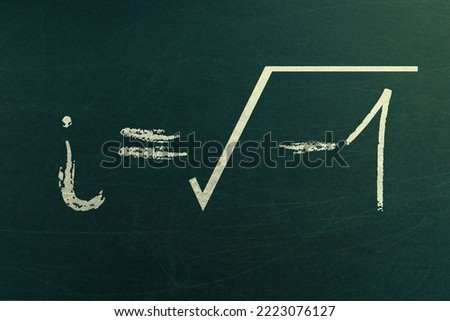 Complex math learning and formula on a chalkboard. i equals square root of negative 1. Handwritten on chalkboard