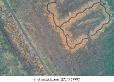 Complex platoon strongpoint with a trench network in a rural field aerial view illustrating tactical defense position and military infrastructure