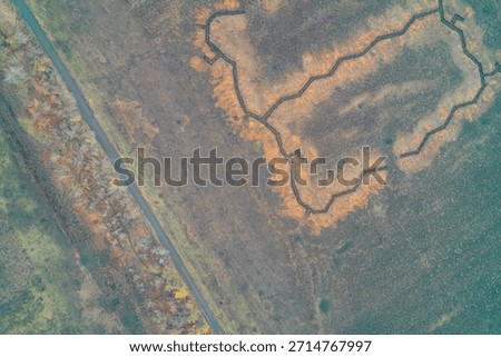 Complex platoon strongpoint with a trench network in a rural field aerial view illustrating tactical defense position and military infrastructure