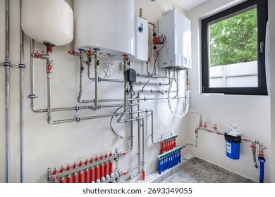 A complex plumbing system is visible in this residential utility room. Tanks and pipes are neatly arranged, showcasing modern heating and water solutions for the home.