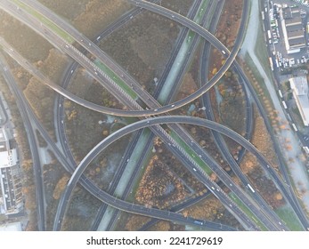 Complex traffic intersection roundabout. Symbolic for choice, direction, route. rond point de grand bigard near Brussels. Belgium. E19. Aerial drone overhead top down view.