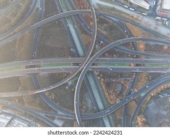 Complex traffic intersection roundabout. Symbolic for choice, direction, route. rond point de grand bigard near Brussels. Belgium. E19. Aerial drone overhead top down view.