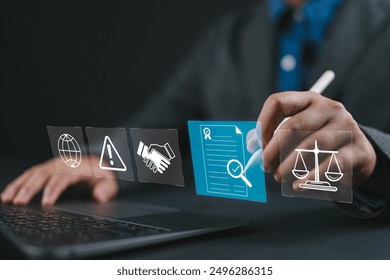 Compliance in business concept. Person use laptop with compliance icon on virtual screen, ensuring the enforcement of laws, regulations, and standards. Stay in line with business policies. - Powered by Shutterstock