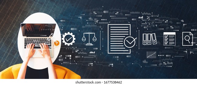 Compliance concept with person using a laptop on a white table - Shutterstock ID 1677538462