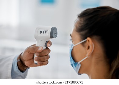 Compliance, Healthcare And Covid With A Doctor Scanning A Patient Temperature With Infrared Thermometer, Checking For A Fever. Concerned Woman Suffering From Corona, Flu Or Cold In Exam Or Consult