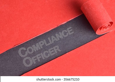 Compliance Officer Word On Blackboard And Red Torn Paper