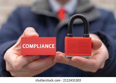 Compliance Standard Regulation Balance Business Technology Concept. Businessman Holding Red Padlock And Polystyrene Block With Compliance Word.