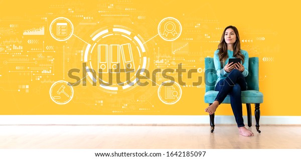 Compliance theme with young woman holding a tablet computer