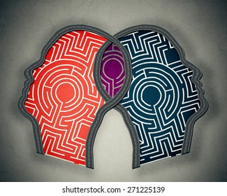 Complicated relationship as concept for group therapy or marriage counseling as two human heads made from maze merging together as icon of partnership solutions isolated gray background 