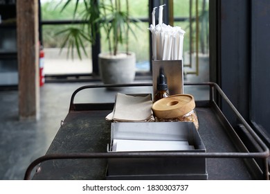 Complimentary Self Serve Table Stand Of Napkin Tissue Paper, Sugar And Straw