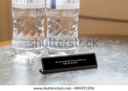 Complimentary water bottle for hotel guest in hotel room